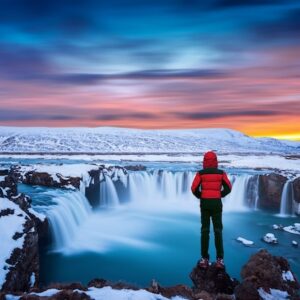 https://img.freepik.com/free-photo/godafoss-waterfall-sunset-winter-iceland-guy-red-jacket-looks-godafoss-waterfall_335224-673.jpg